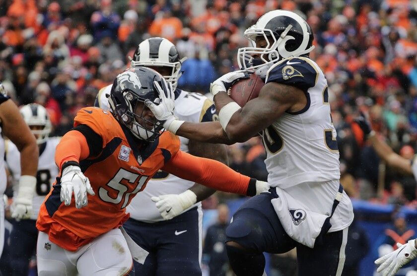 Los Angles Rams Running Back Todd Gurly Breaking A Tackle Versus The Denver Broncos